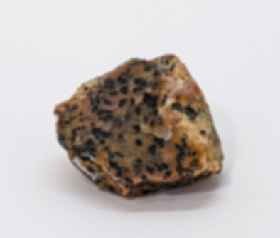 Raw Cheetah Jasper rock with distinctive spotted pattern resembling a cheetah’s coat.