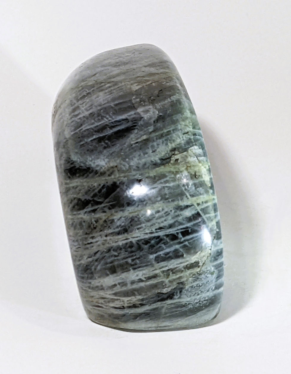 Thumbnail: Purple Labradorite with flashes of blue, green, and gold, known for its mystical energy, promoting intuition