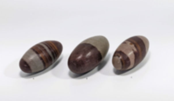 Sacred Shiva Lingam crystal in earthy brown and beige tones