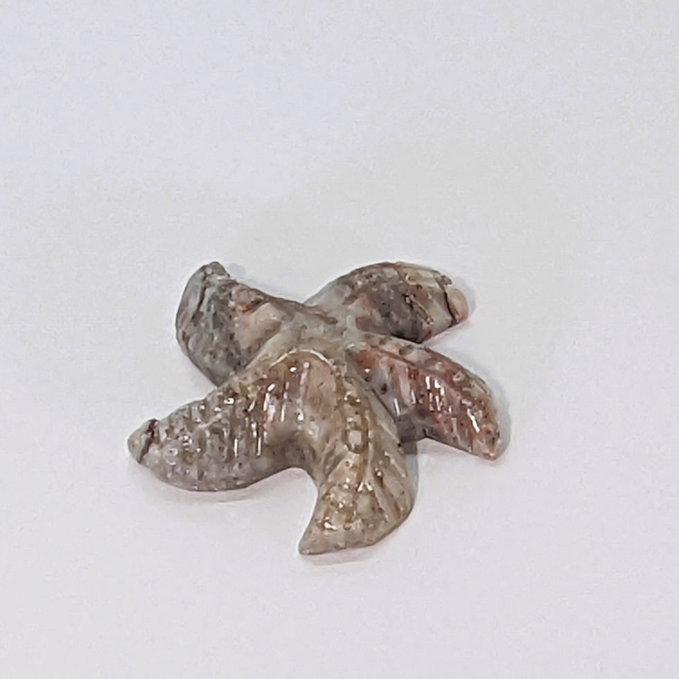 Thumbnail: Small soapstone starfish carving, representing renewal, intuition, and regeneration.
