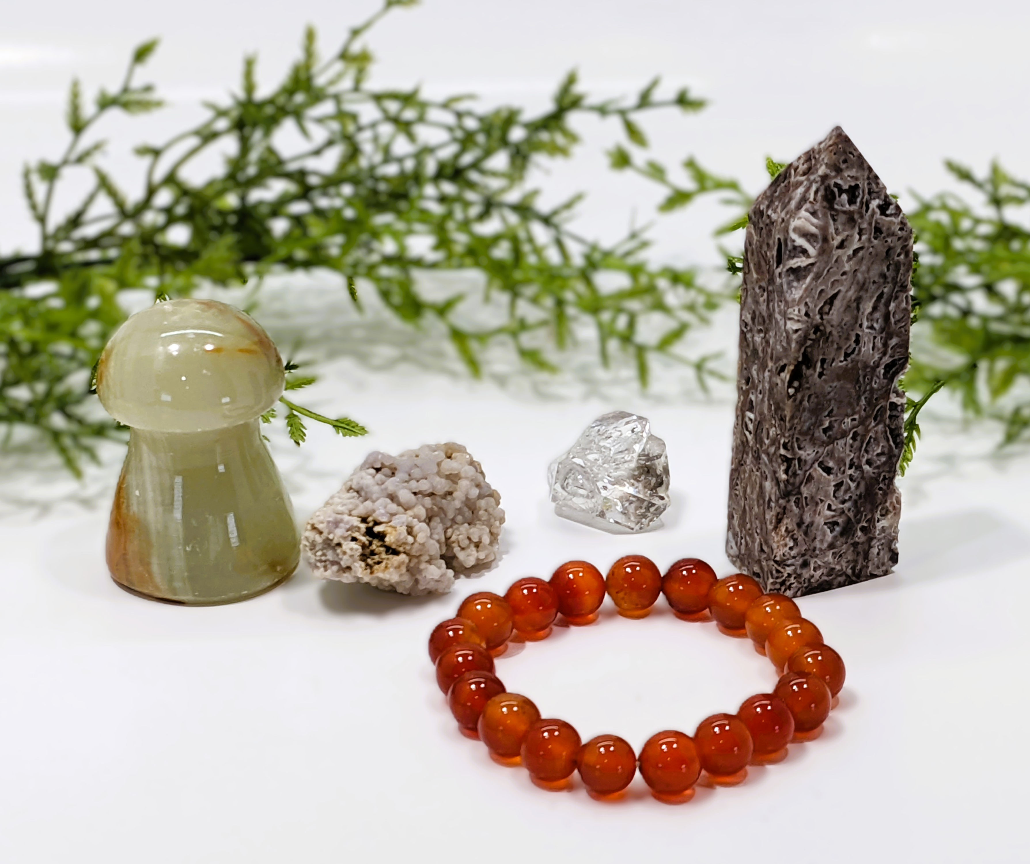 Sphalerite tower, Herkimer Diamond, Grape Agate, Onyx mushroom, Carnelian bracelet