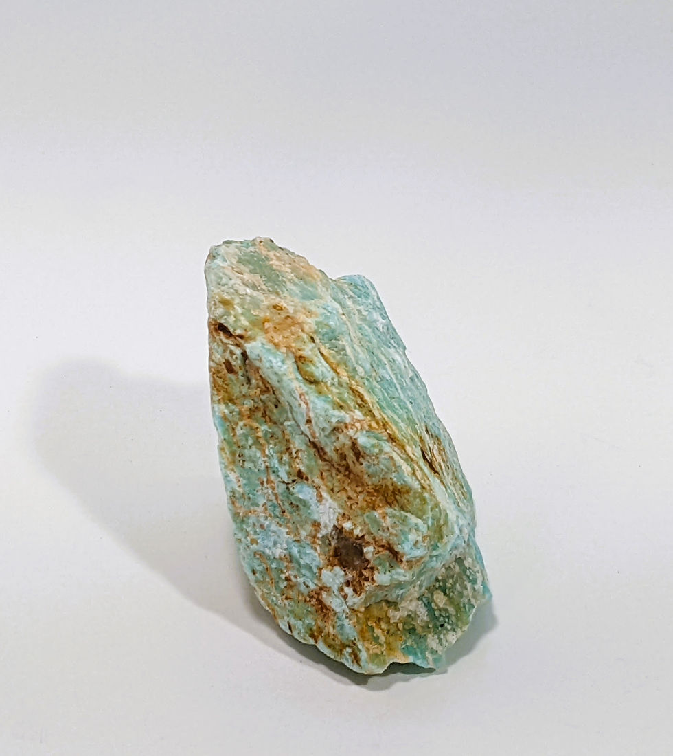 Thumbnail: Rough Amazonite stone with rugged surface and soft aqua glow.