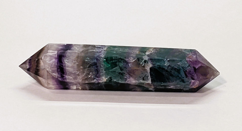 Thumbnail: Polished double terminated Rainbow Fluorite point showcasing vibrant multi-colored bands.