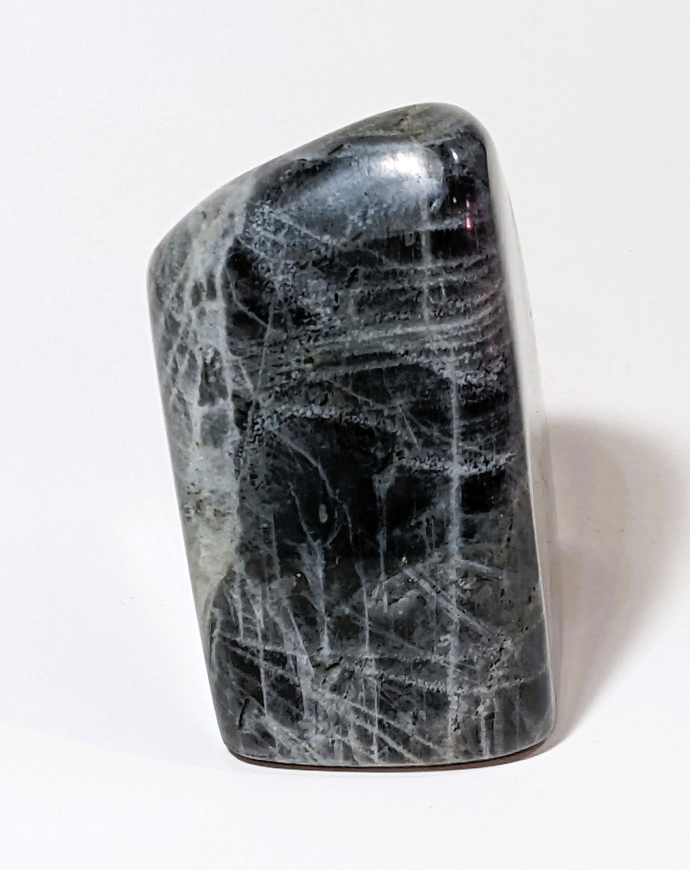 Thumbnail: Purple Labradorite stone with soft iridescent flashes