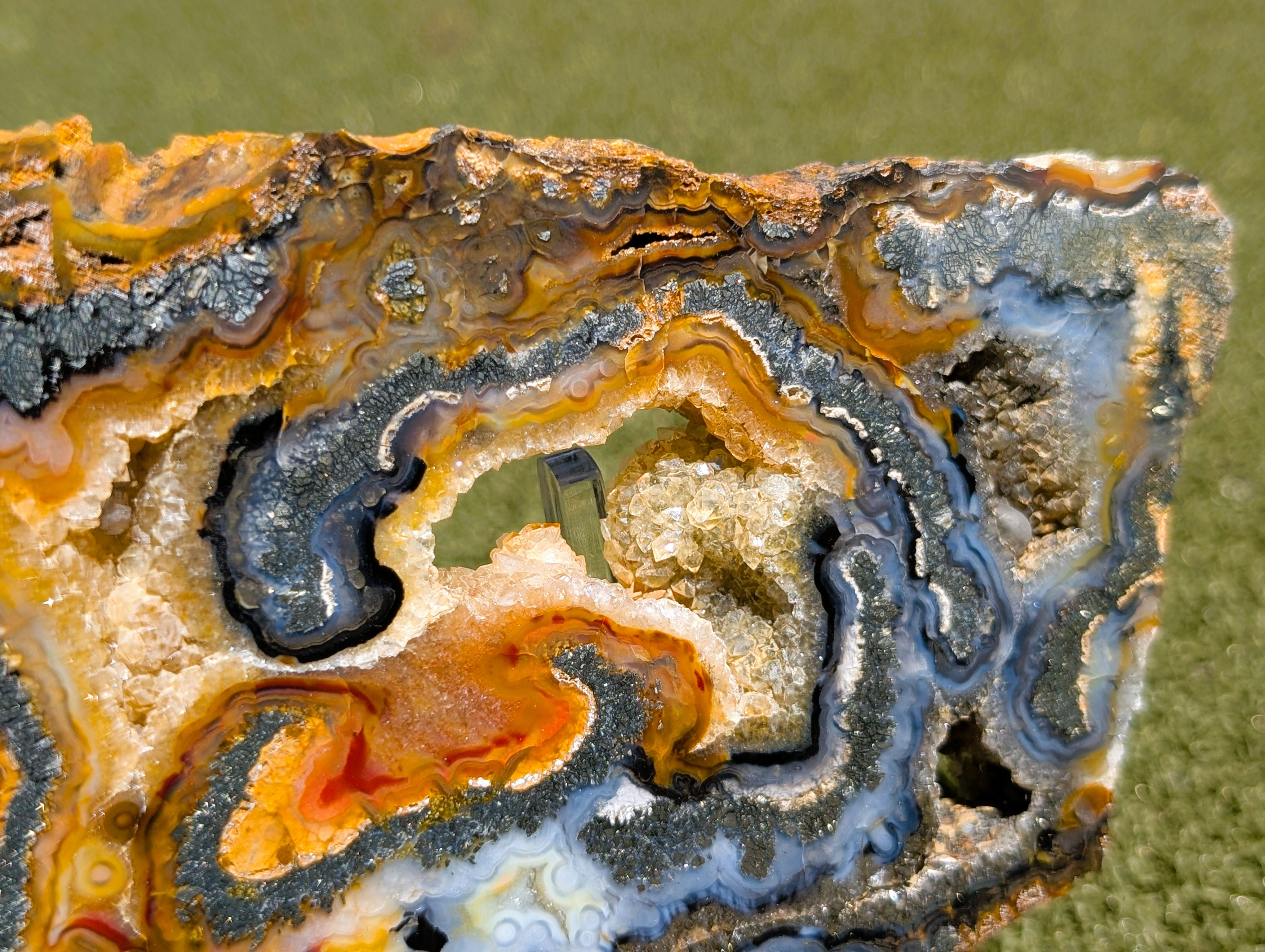 metallic plume marcasite formations within translucent agate