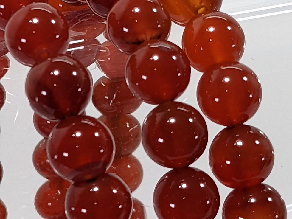Carnelian Bracelet with vibrant orange-red hues, known for its energizing and motivating properties. At jujujems.