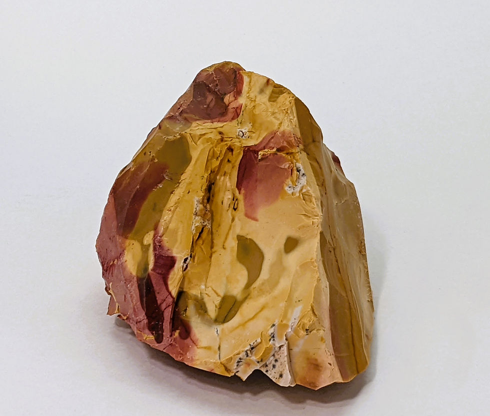 Thumbnail: Unpolished Mookaite with vibrant banding.