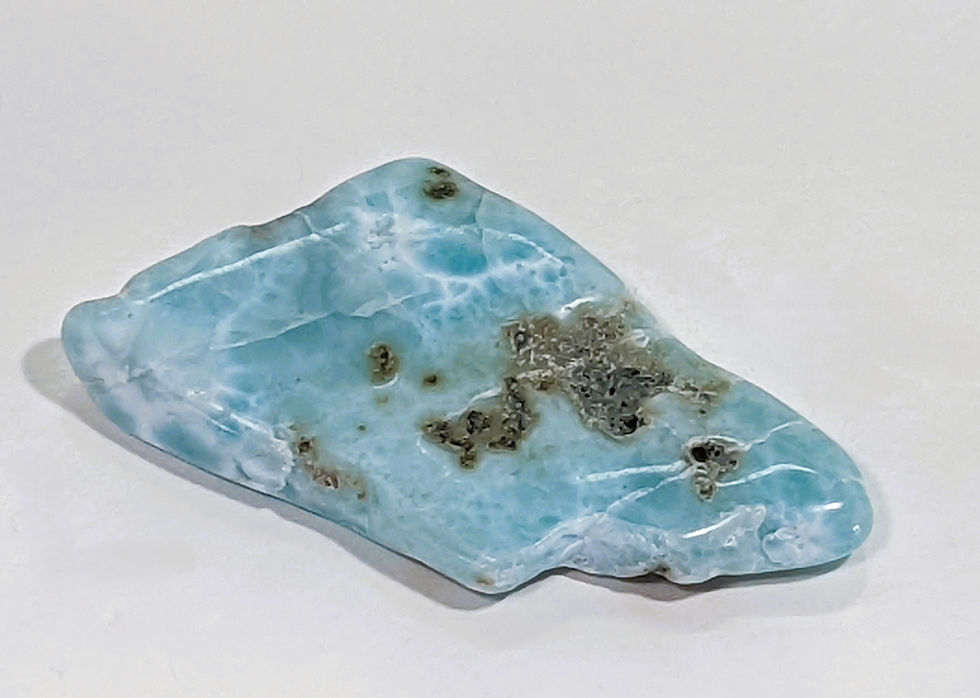 Thumbnail: Larimar gemstone with ocean-inspired tones