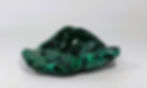 Elegant polished malachite freeform showcasing deep green hues and intricate natural banding.