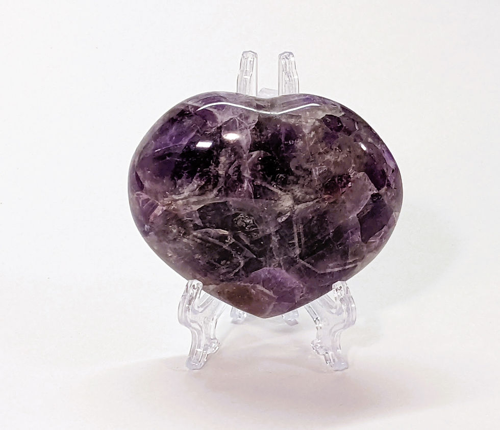 Amethyst heart with rich purple tones, known for calming energy and spiritual clarity. At jujujems.