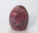 Polished Rhodonite freeform promoting compassion and forgiveness.