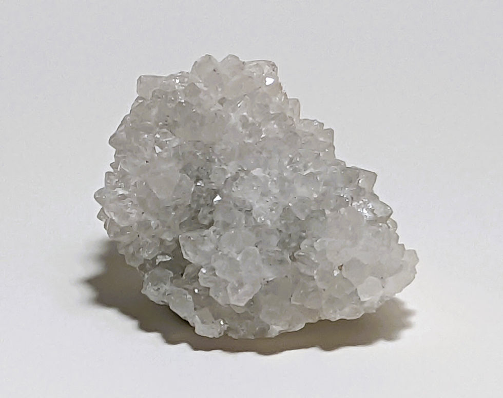 Apophyllite crystal with clear, sparkling formations, known for its calming and spiritual energy. At jujujems.