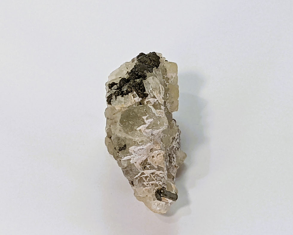 Thumbnail: Natural Calcite specimen featuring Pyrite crystals embedded in creamy white formations.