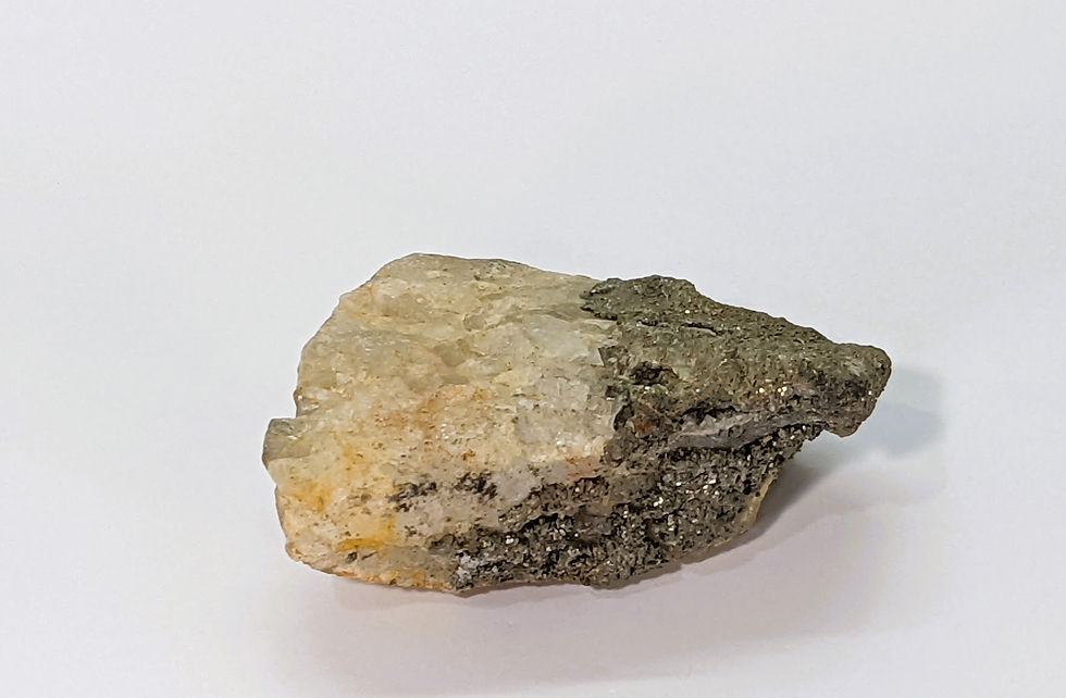 Rough Calcite crystal cluster with metallic Pyrite inclusions, with natural texture and sparkling gold accents.
