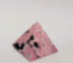 Polished Rhodonite pyramid for focus and heart chakra support.