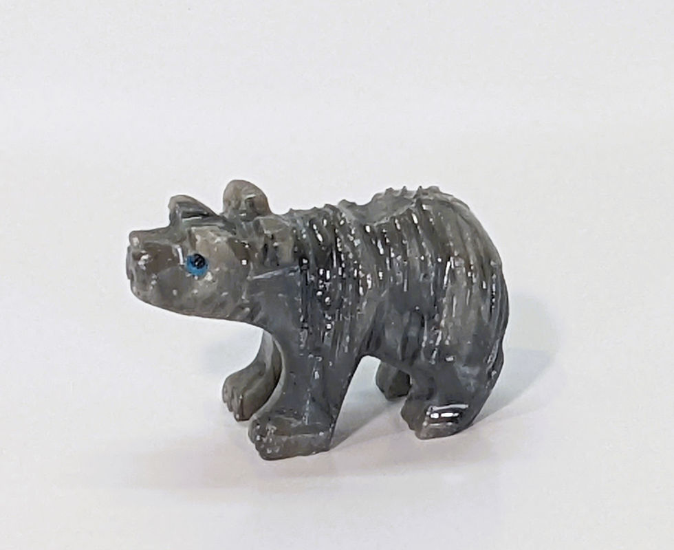 Thumbnail: Pocket-sized soapstone bear carving, symbolizing emotional healing and quiet strength.