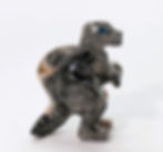 Soapstone T-Rex carving, showcasing bold features and Jurassic presence.