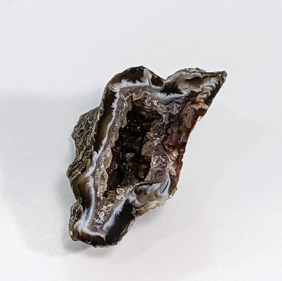 Thumbnail: Amazing cut Oco Agate geode halves showing off their quartz druzy
