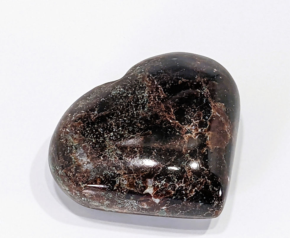 Thumbnail: Polished Garnet Hearts showcasing vibrant red tones and intricate crystal reflections.
