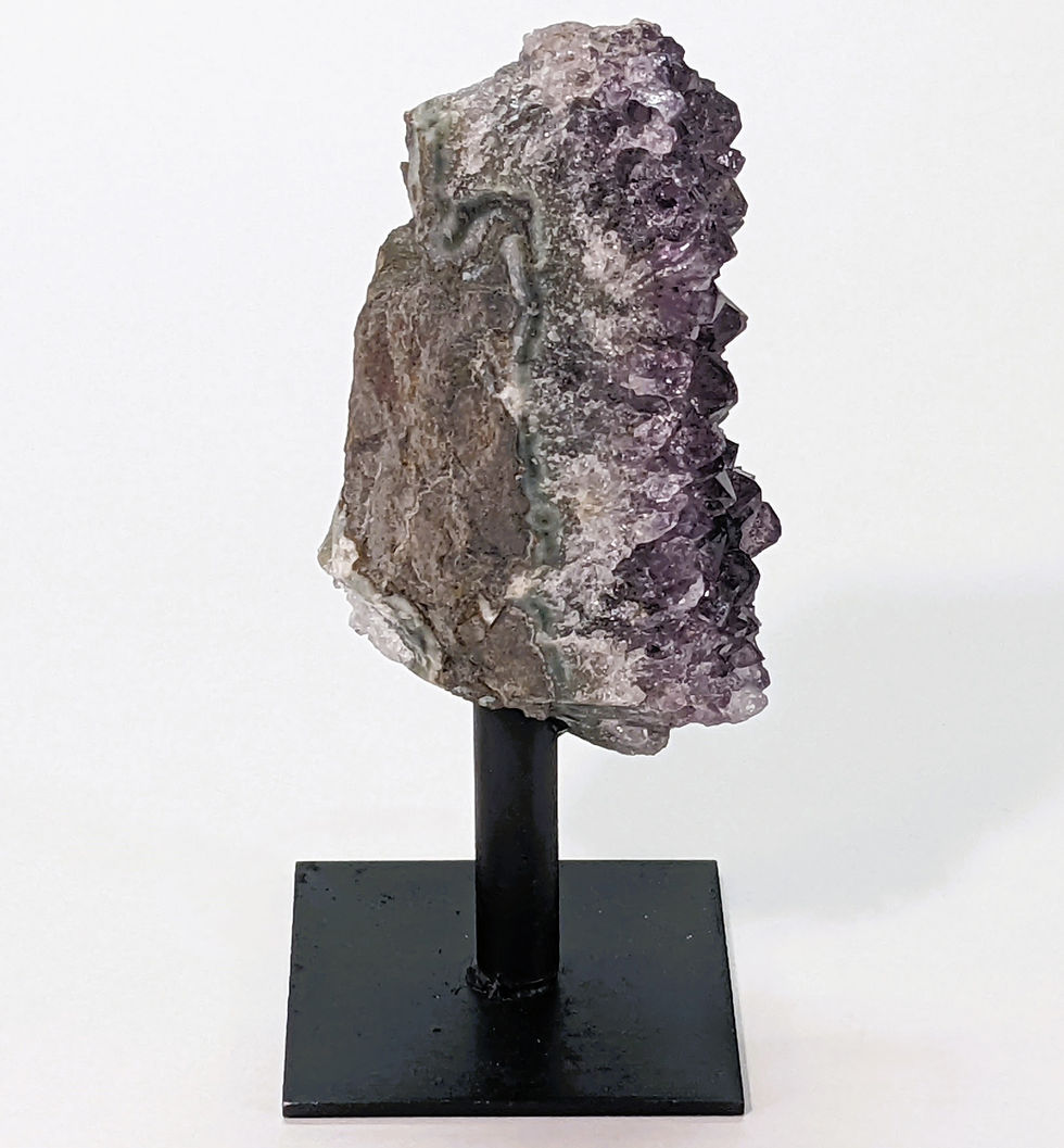 Thumbnail: Amethyst cluster on metal stand at jujujems.