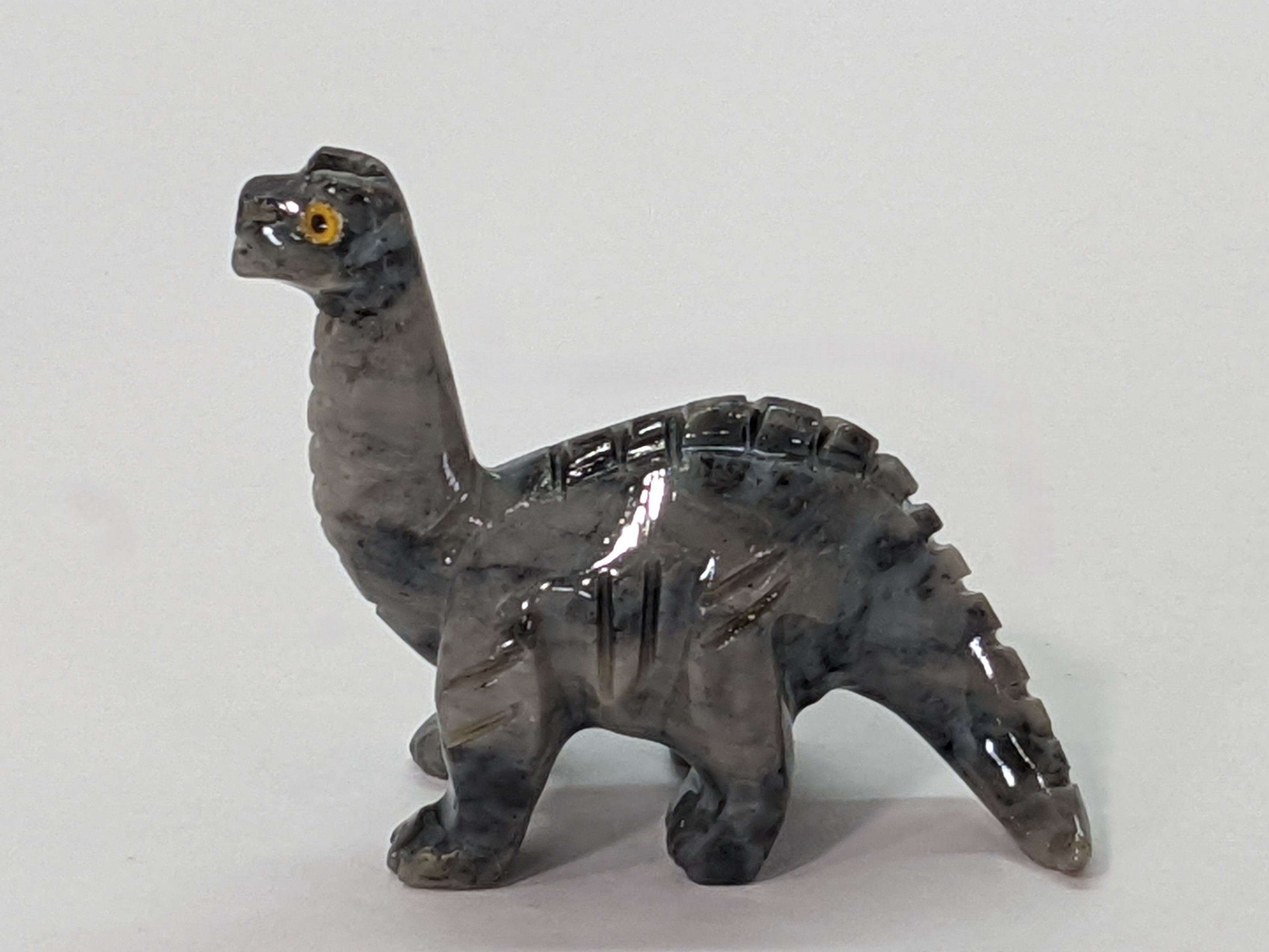 Soapstone Brontosaurus carving, symbolizing calm strength, endurance, and prehistoric wonder.