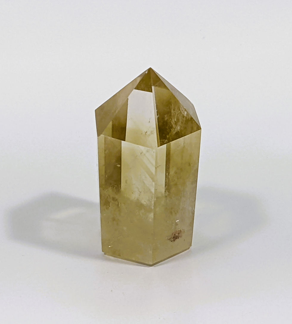 Thumbnail: Smoky Citrine with a blend of smoky brown and golden hues, known for grounding and abundance-attracting properties. jujujems