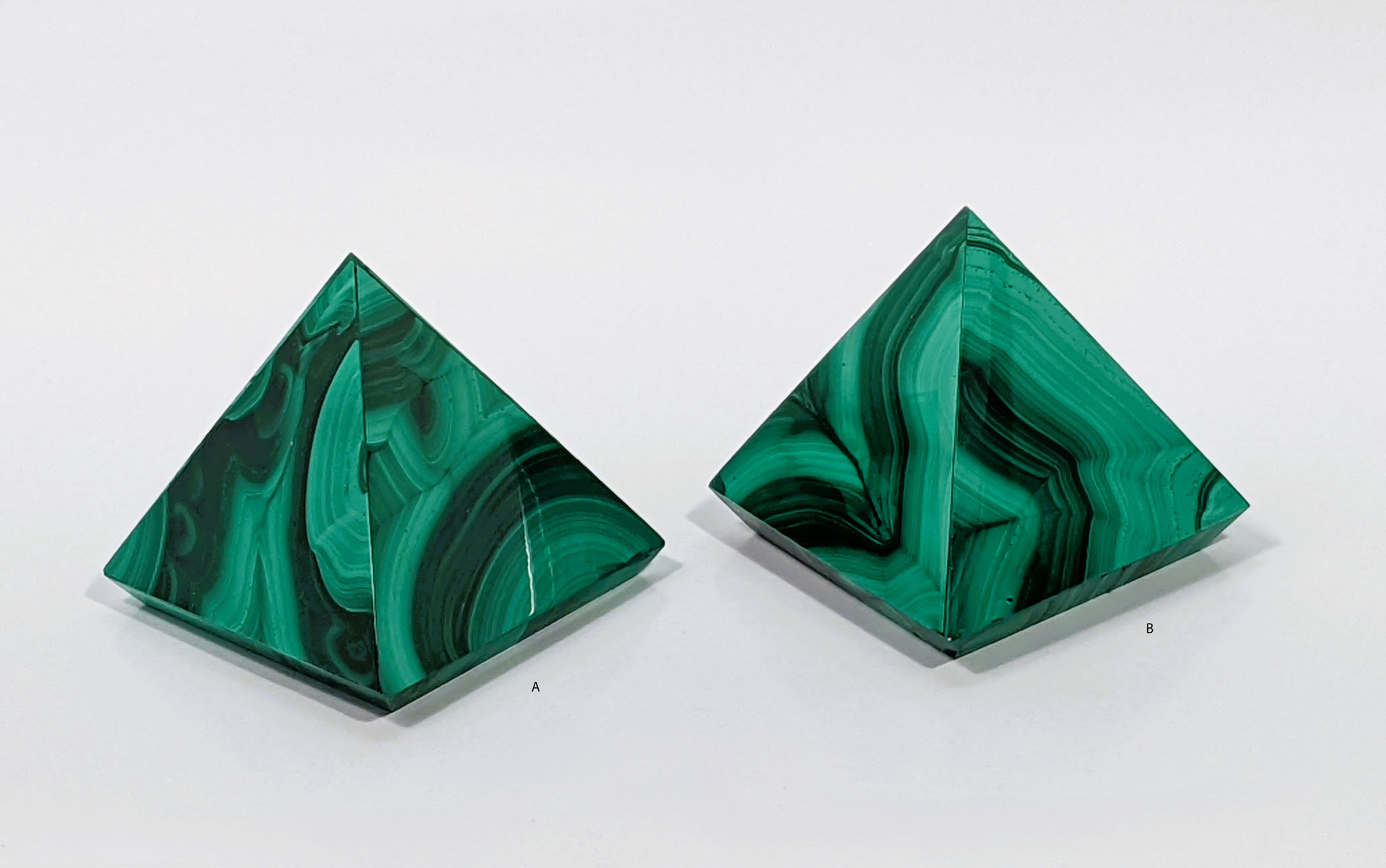 Polished Malachite gemstone with green swirls for heart chakra healing