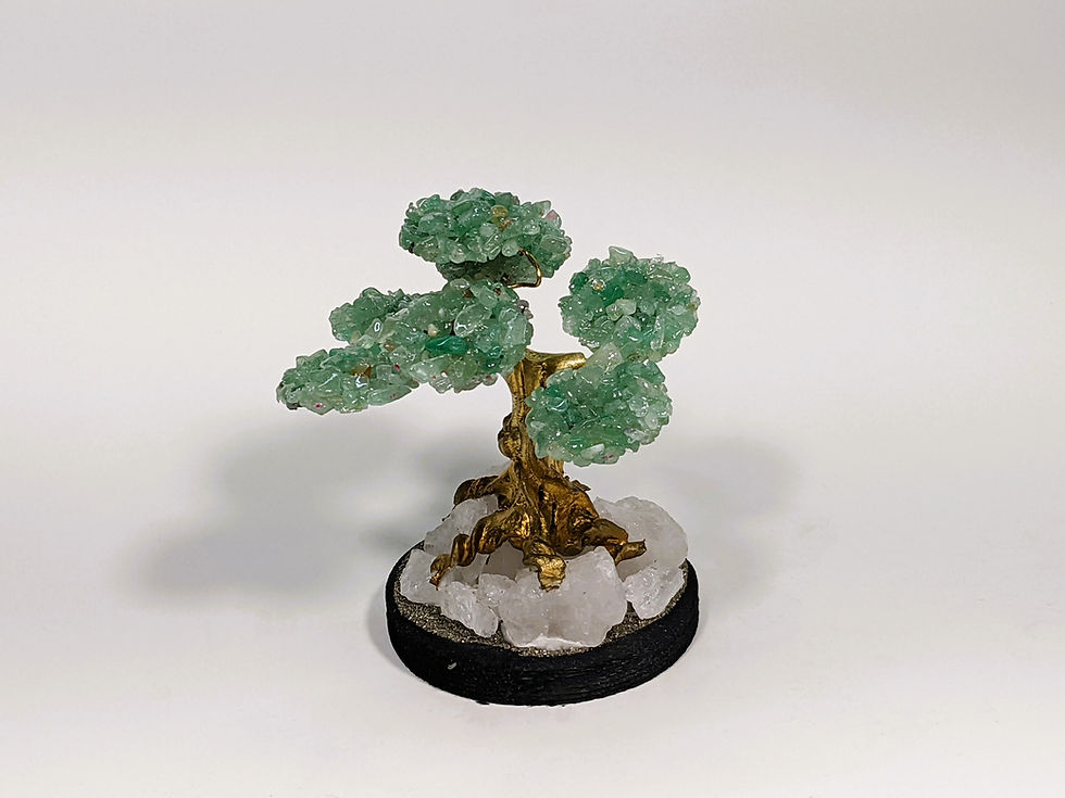 Jade Gemstone Tree: Elegant tree with lush jade crystals, promoting harmony and prosperity. Find it at jujujems.