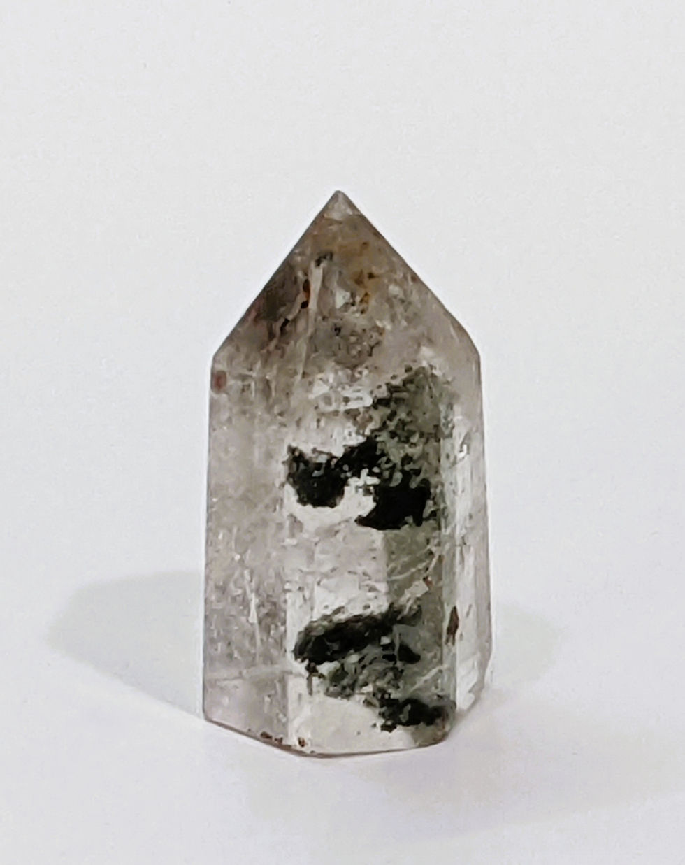 Garden Quartz points with vibrant green and brown mineral inclusions, reflecting nature’s beauty.