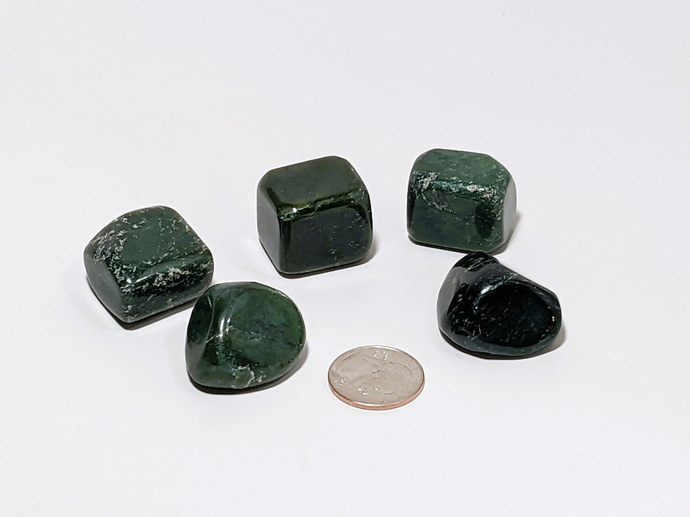Jade tumbles with subtle striations and vibrant green color