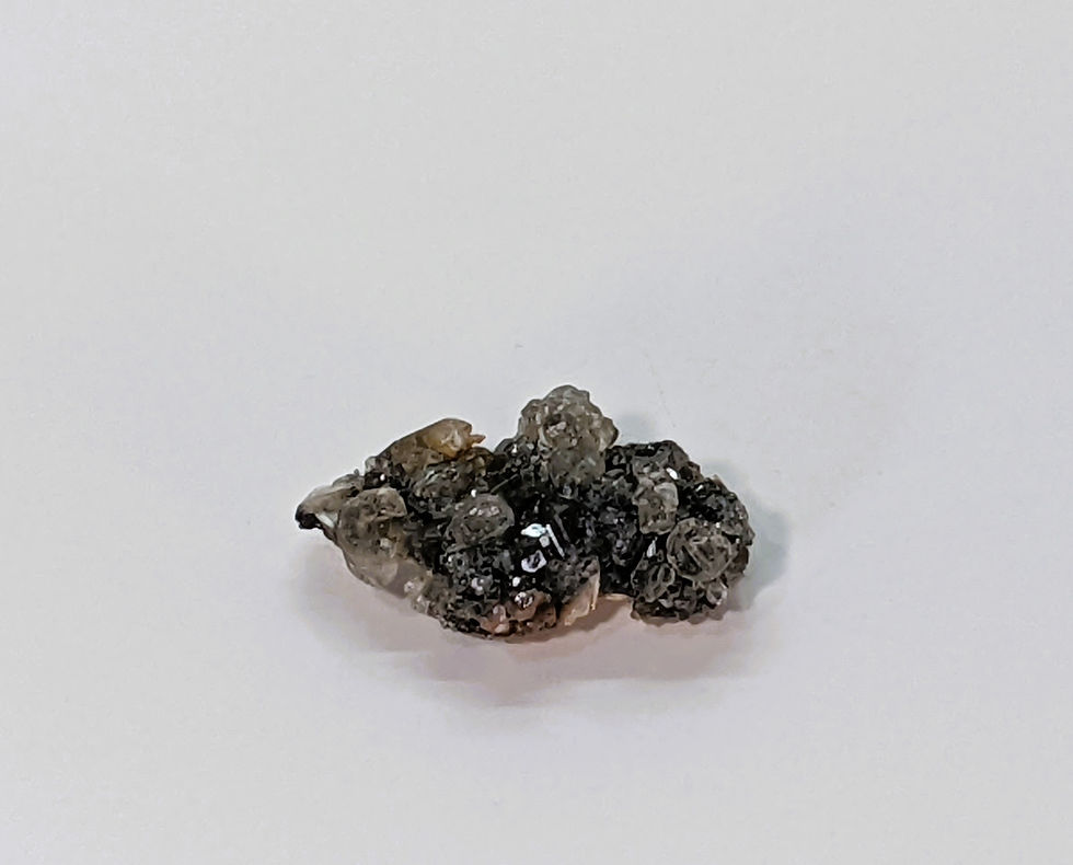 Thumbnail: Moroccan Barite rosettes accented by silvery Skutterudite crystals.