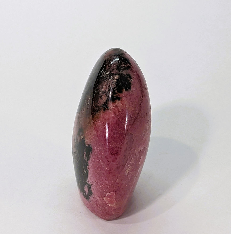 Thumbnail: Rhodonite freeform with pink and black veining for emotional balance.