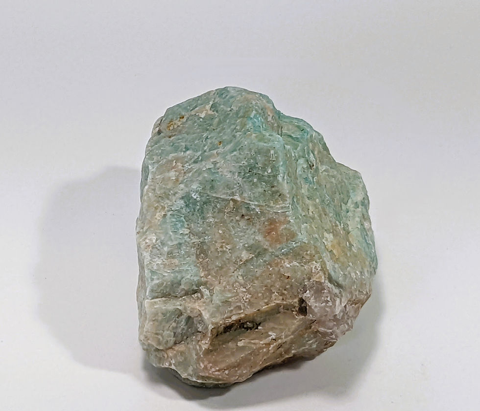 Thumbnail: Rough Amazonite mineral chunk with vibrant teal hues.
