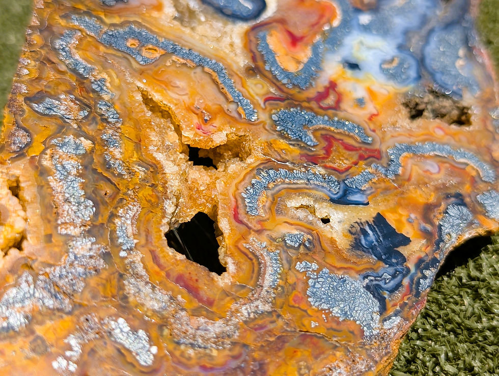 Thumbnail: metallic plume marcasite formations within translucent agate