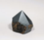 Hematite Rough Point from jujujems: a grounding stone that boosts confidence, balance, and mental clarity.
