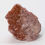 Thumbnail: Raw Red Aventurine stone showing unpolished surface and vibrant mineral hues.