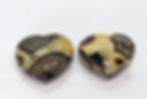 Septarian Heart with fossil-like patterns of yellow, brown, and black hues, showcasing the unique composition.