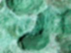 Fibrous Malachite: Known for its vivid green texture and transformative energy. Find it at jujujems today.