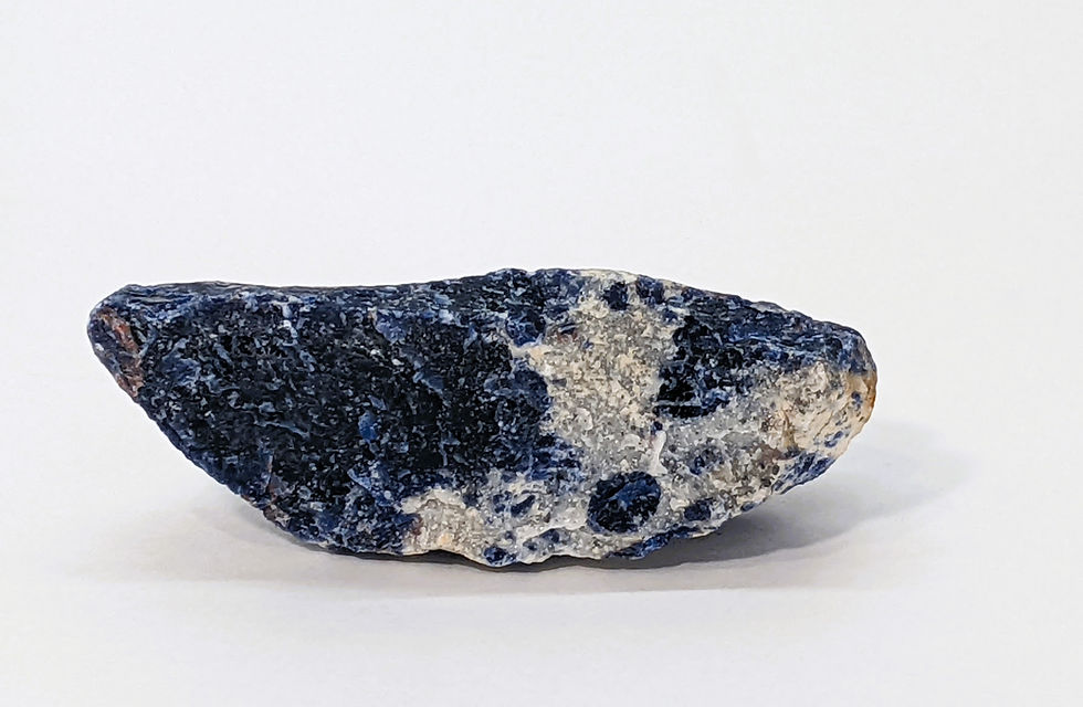 Thumbnail: Rough Sodalite specimen with deep blue tones and natural white veining.