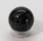 Natural Nuumite crystal sphere showcasing shimmering dark patterns and reflective mineral highlights.