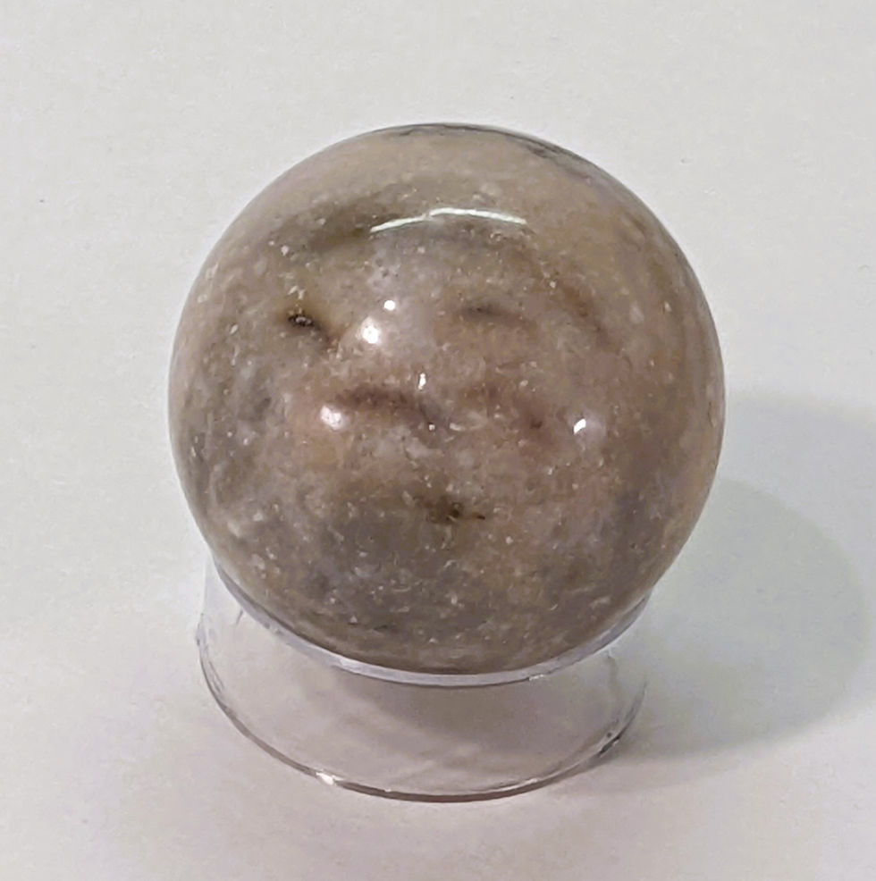 Pink Zebra Jasper displaying bold pink and cream stripes, valued for its calming energy and promotes balance and harmony