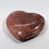 Thumbnail: stunning and glossy hearts carved from petrified wood