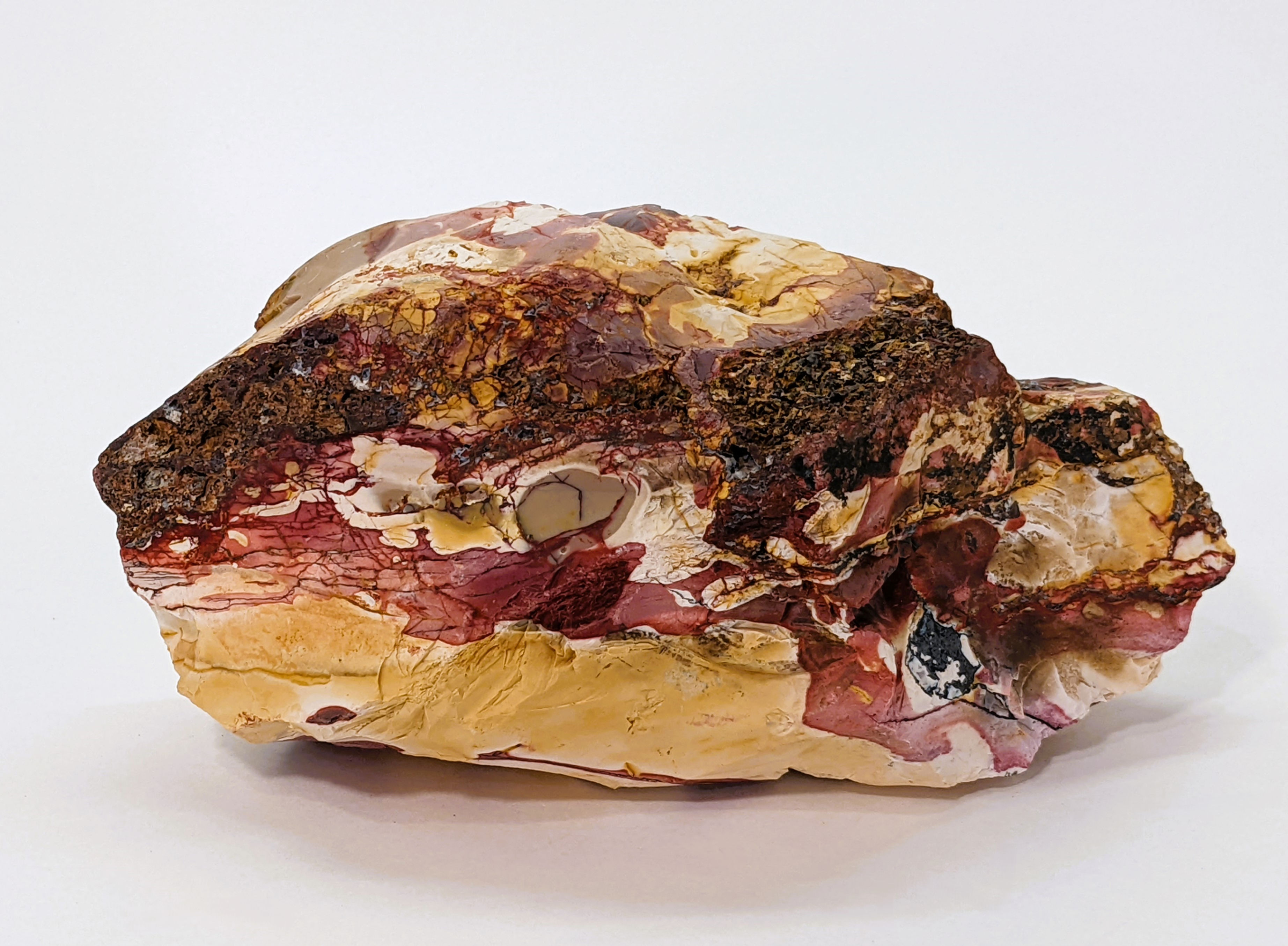 Rough Mookaite with earthy desert colors.