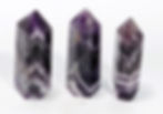 Polished Chevron Amethyst crystal tower showing layered violet and quartz bands