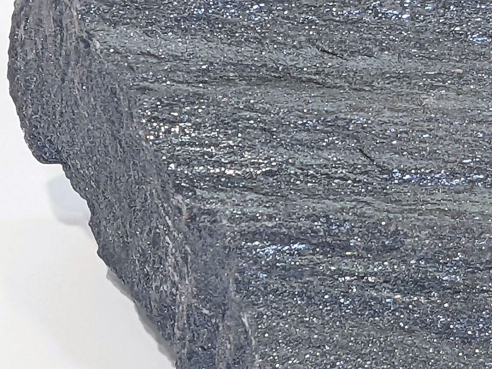Thumbnail: Rough Specular Hematite specimen with silvery metallic sparkle and layered texture.