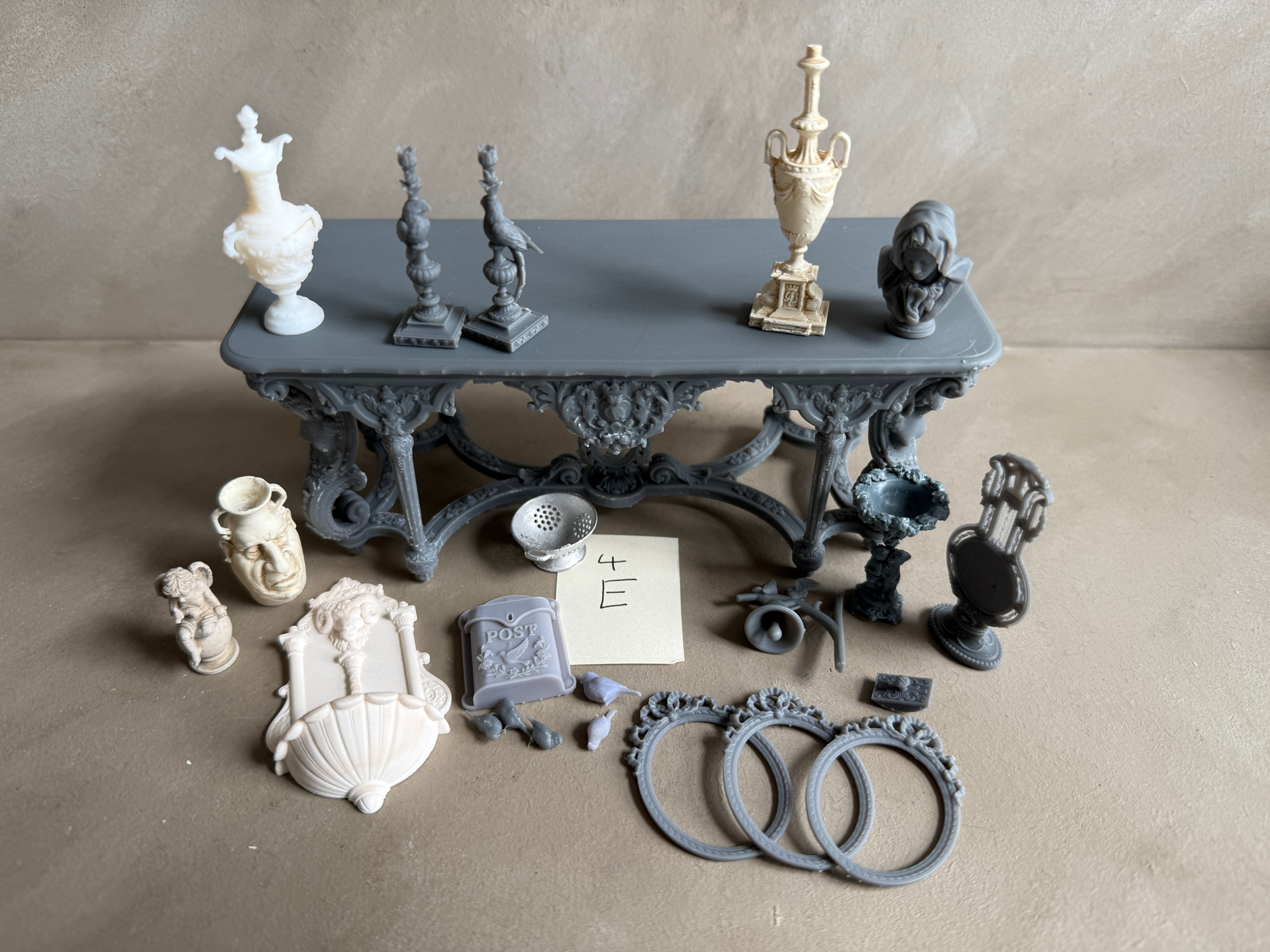 4E Various items including Large grey table and candleholders Slight s