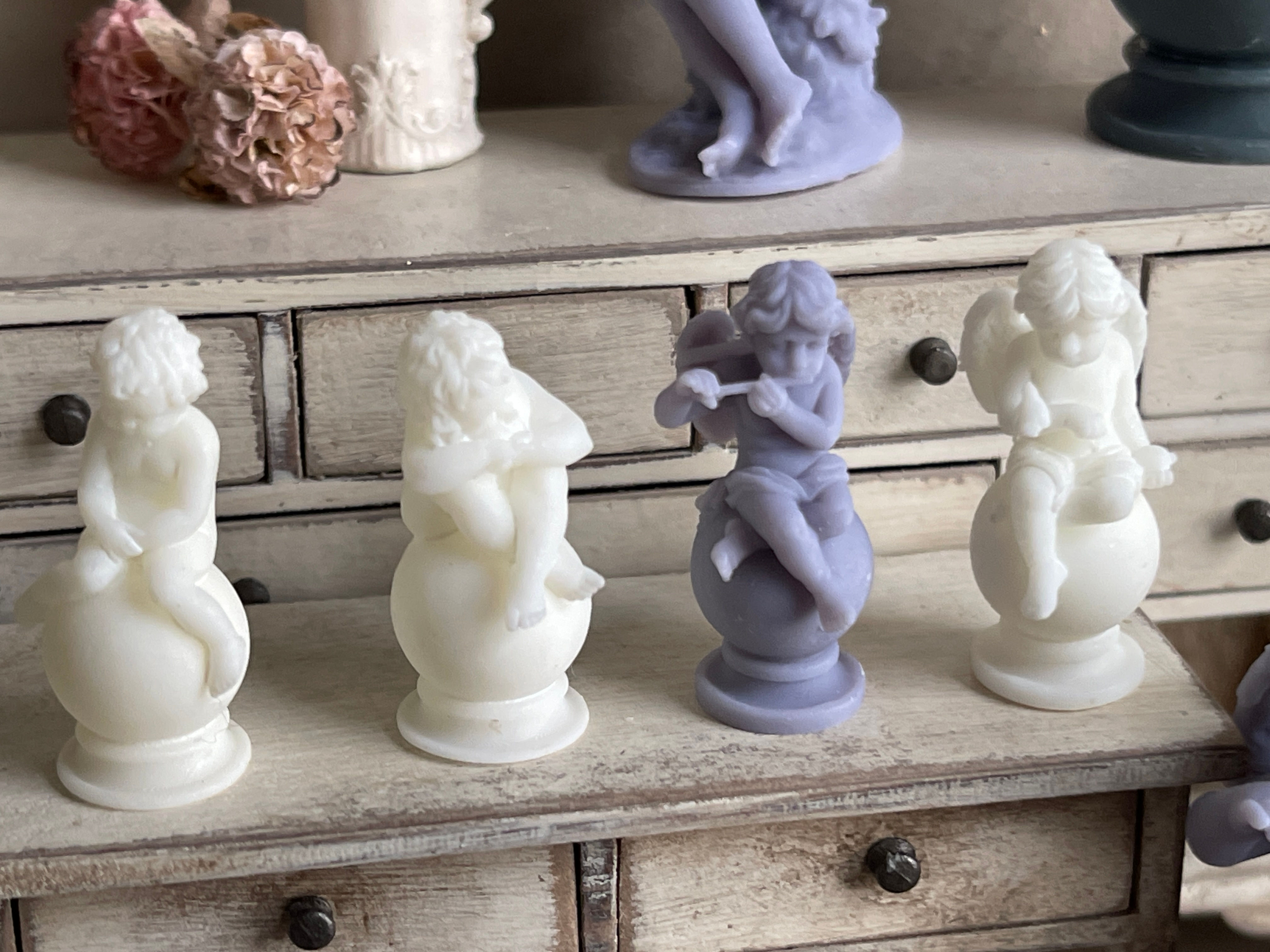 DISCONTINUED cherubs on a ball