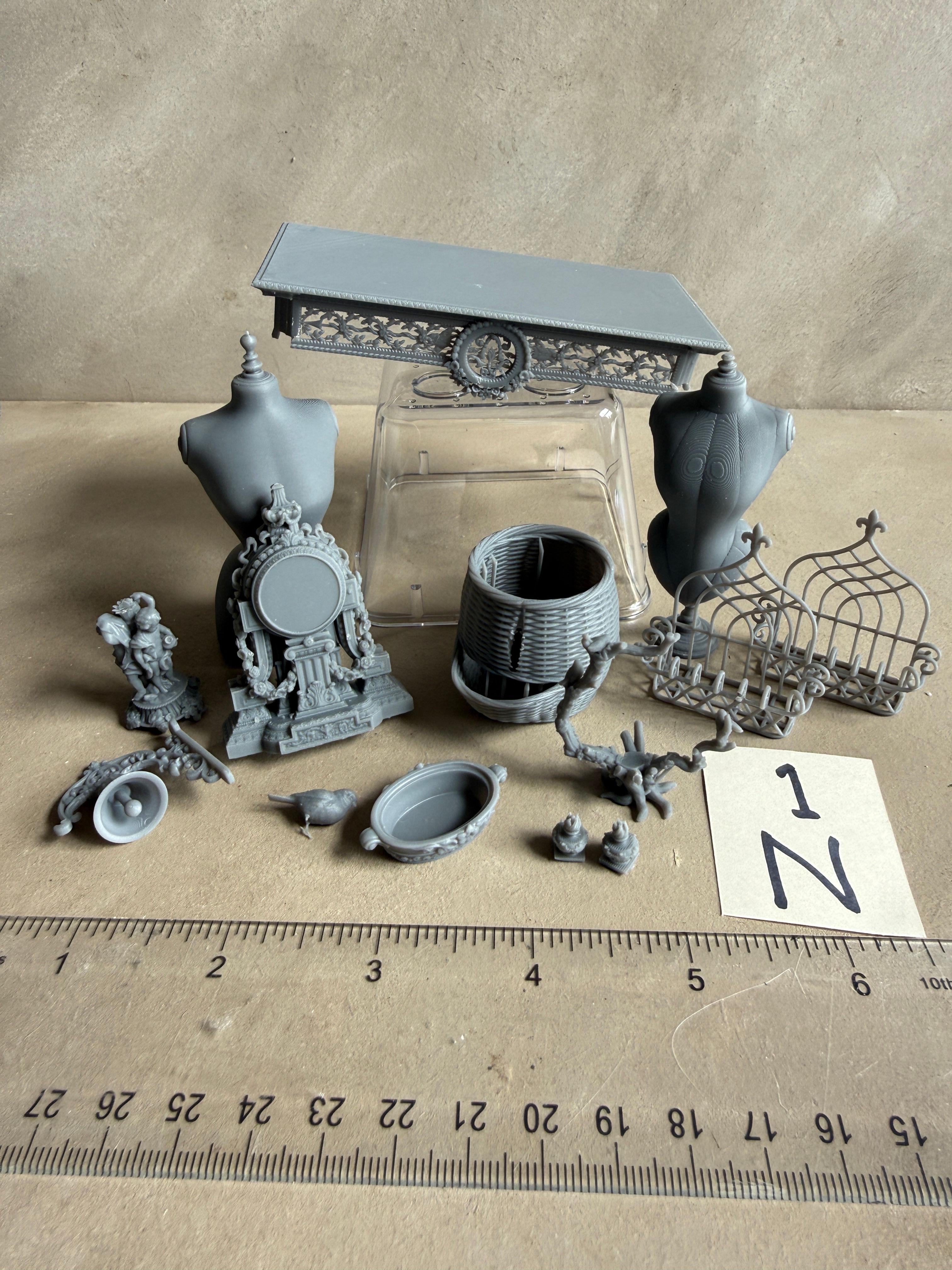 1N UNPAINTED Group of items clock, bell, mannequins Slight seconds
