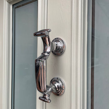 Premium 'Doctor Knocker' on Solidor 'Ludlow' composite door in Painswick with contrasting Schwarzbraun Black framework and Victorian Glass design.