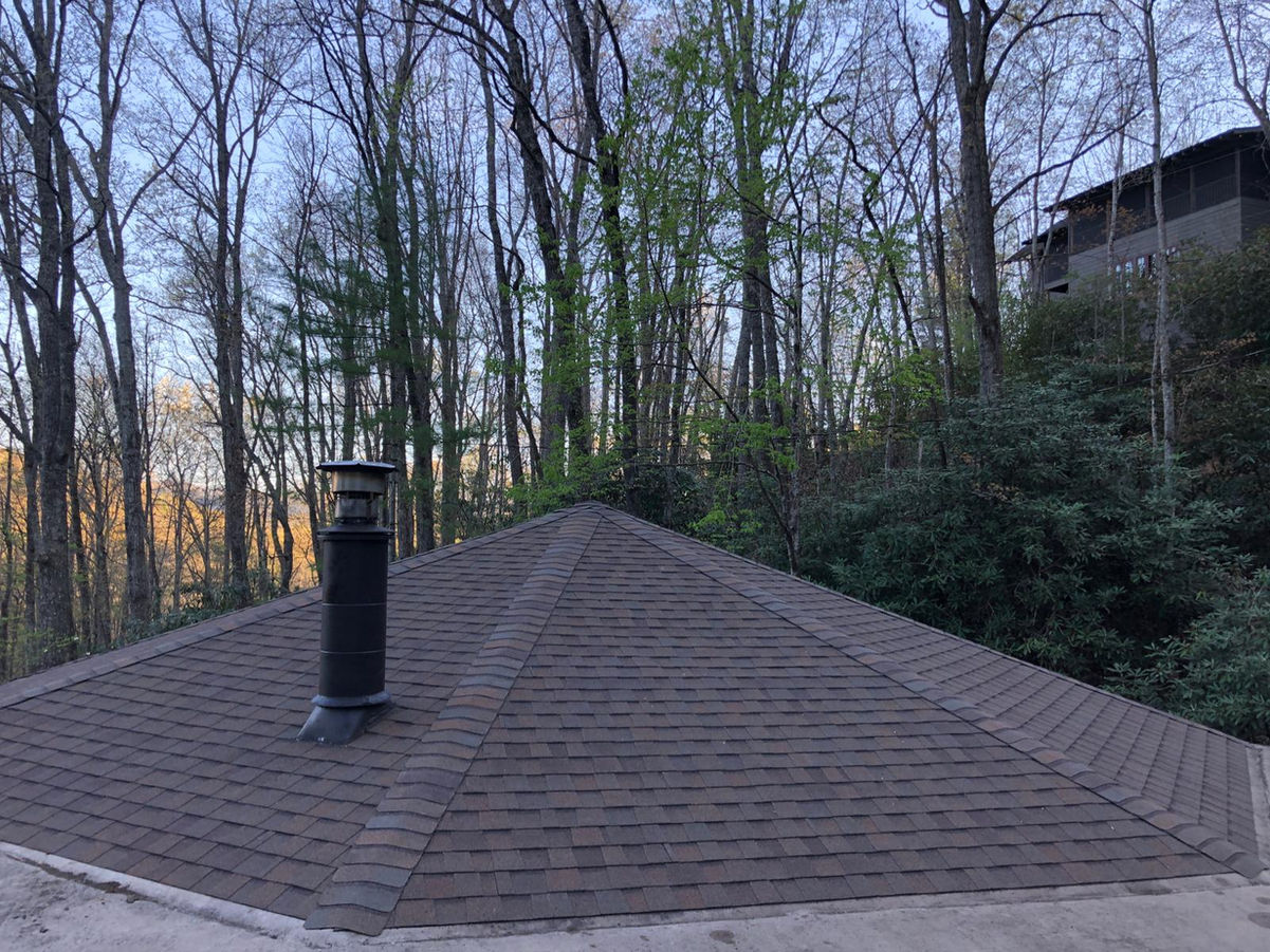 Elevate the beauty and protection of your Black Mountain, NC rotunda home with our premium asphalt shingle roof replacement services. Our skilled roofing professionals specialize in preserving the unique architectural features of rotunda homes while delivering exceptional durability and performance.

With meticulous attention to detail and the use of top-quality materials, we ensure a seamless roof replacement process that enhances both aesthetics and functionality. Safeguard your home against the unpredictable North Carolina weather with our reliable asphalt shingles, designed to withstand wind, rain, and UV exposure.

Our experienced team is committed to providing a stress-free experience, minimizing disruptions to your daily life. We take pride in delivering exceptional craftsmanship, leaving you with a beautiful, long-lasting roof that complements the distinct character of your rotunda home.

Trust our locally based experts for your asphalt shingle roof replacement needs in Black Mountain, NC. Contact us today to schedule a personalized consultation and take the first step towards enhancing your rotunda home's curb appeal and protection.